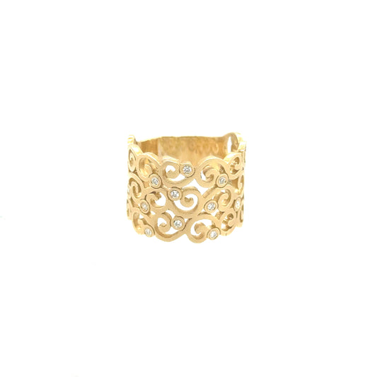 yellow gold scroll design ring with bezel set diamonds
