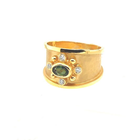 Hammered yellow gold ring with green oval center stone and diamonds